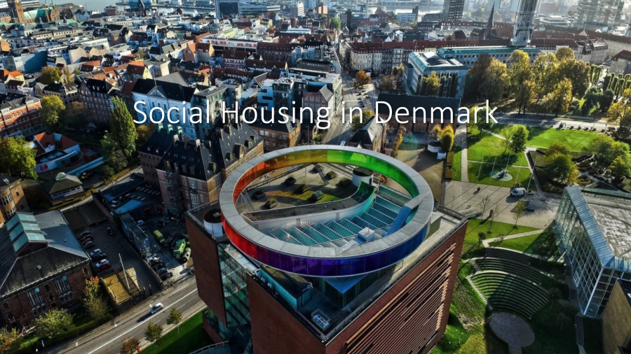 A photo of a city showing different housing developments. The words Social Housing in Denmark are written on the photo.