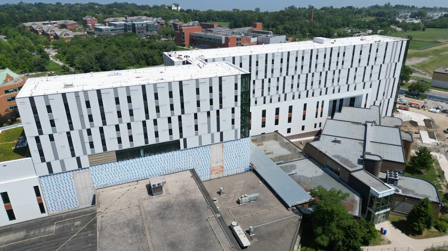 The exterior of two buildings that are under construction.