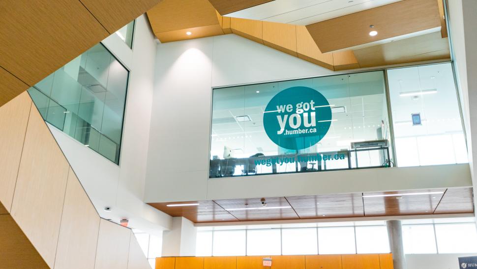 A view inside the Humber Learning Resource Commons with a sign in the window reading "We got you"