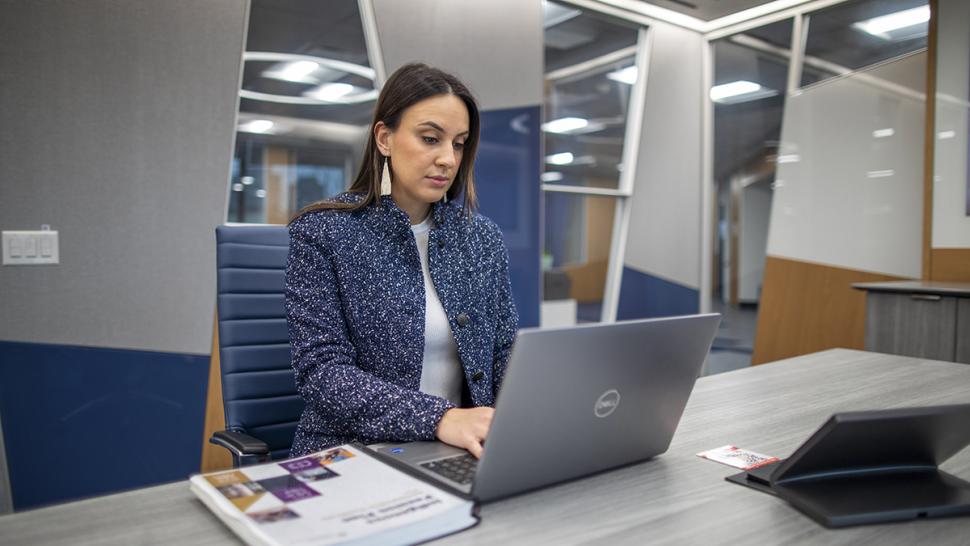 Humber Polytechnic is relaunching the Indigenous Pension Plan Administration Certification program. A person is sitting down and working on a computer.