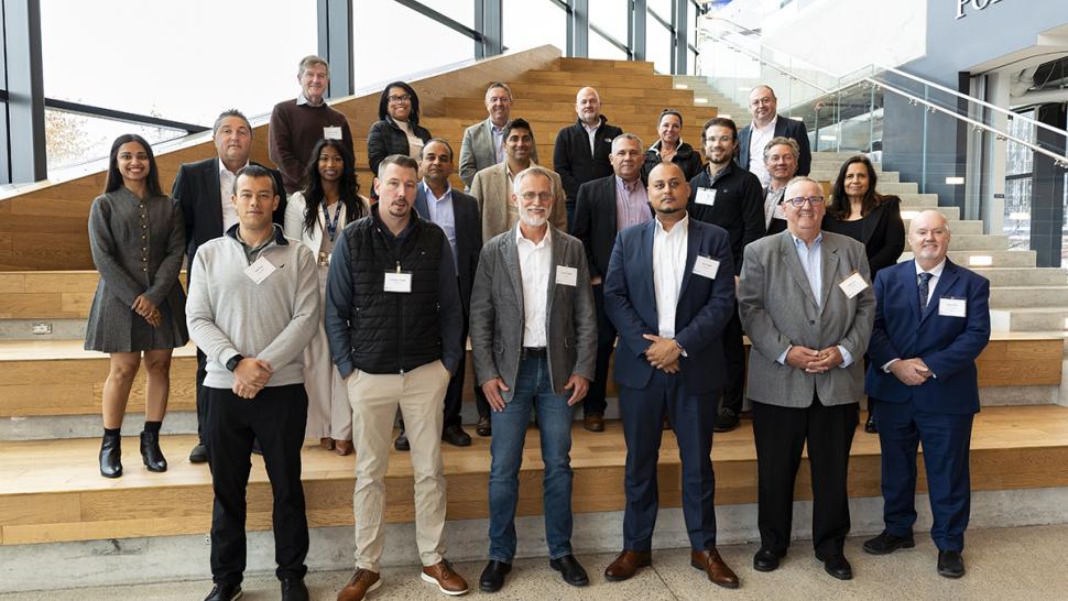 A group of people stand together.