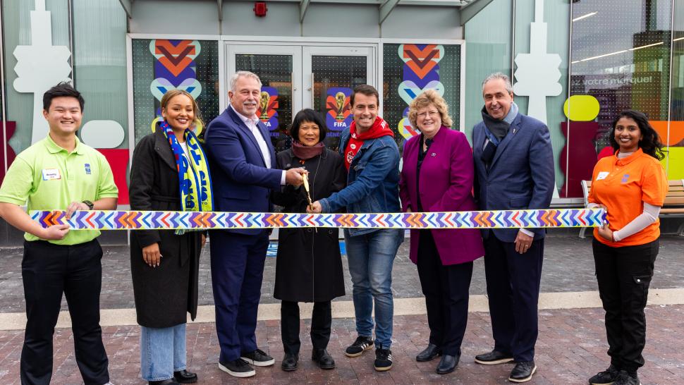 Dignitaries and volunteers cut the ceremonial ribbon to the Volunteer Centre. 