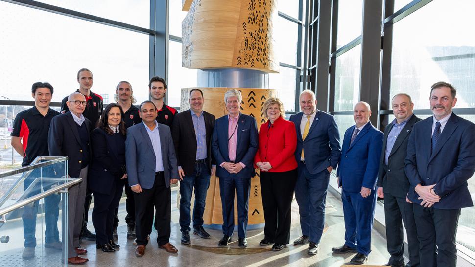 A group of people stand together.