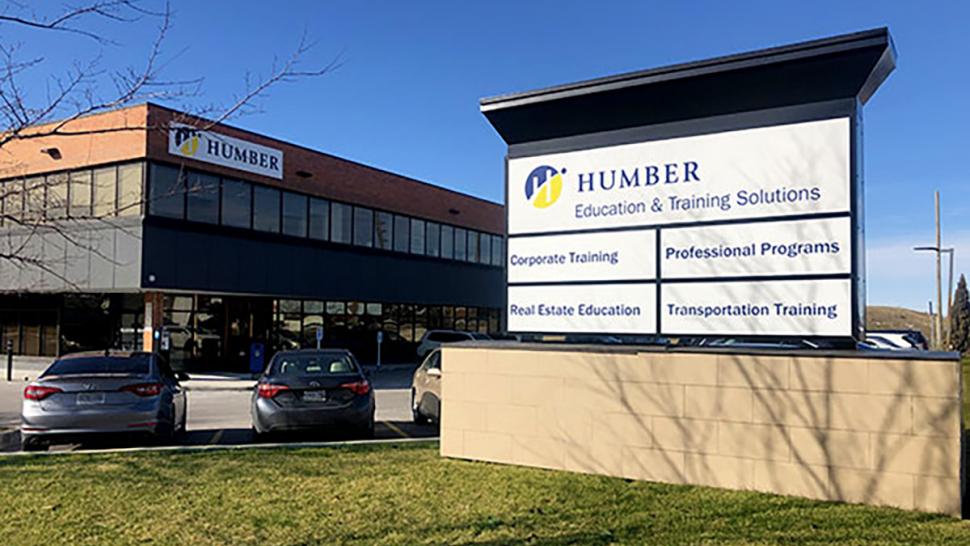 A sign outside a building that reads Humber Education & Training Solutions.