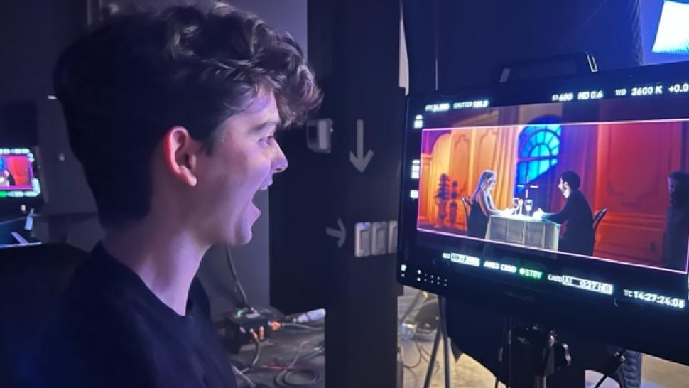Humber College students had access to William F. White International’s WFW TechLab that offers an immersive, hands-on, real-time learning experience in virtual production. A person looks at two people sitting at a table having a meal on a screen.