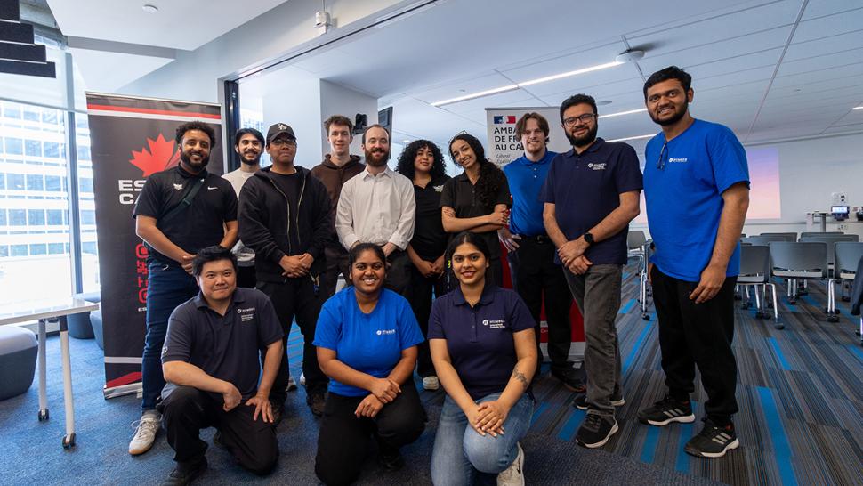 Humber Polytechnic hosted France x Canada 2.0: Empowering Inclusive Play, a cross-cultural celebration of esports, education, and innovation at Humber Downtown campus as part of Toronto Games Week. A group of smiling people are standing together. Many of them are wearing Humber Polytechnic shirts.