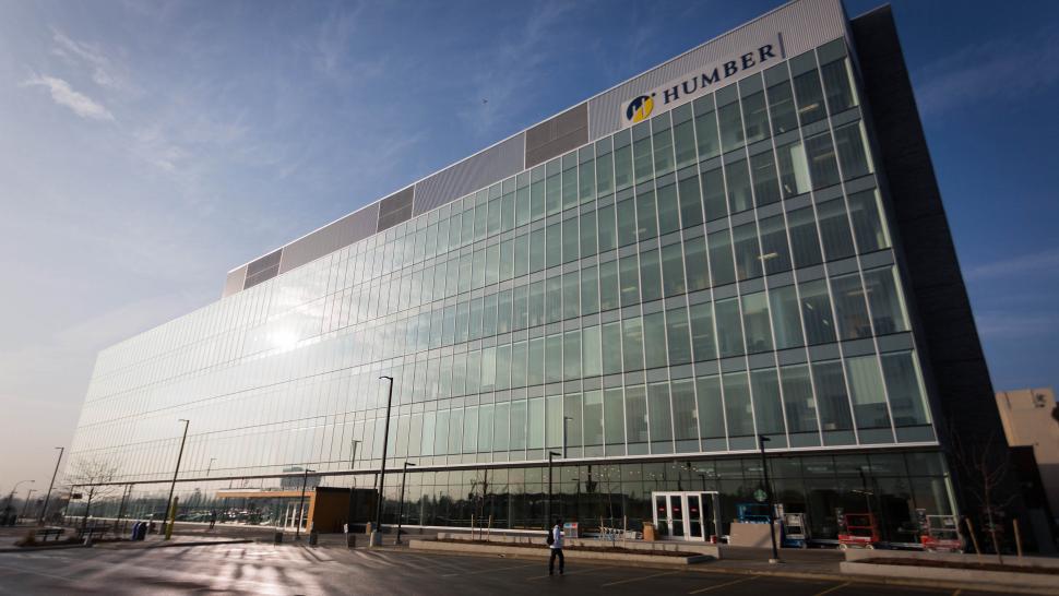 An exterior of a building that has the Humber College logo on it.