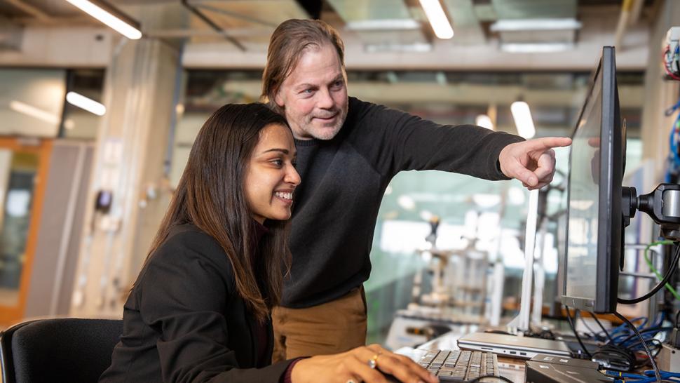 Humber Polytechnic has renewed an agreement with Northeastern University in Toronto that provides a pathway from the polytechnic to Master’s degree studies at the university’s Toronto campus. Two people are in front of a computer as one person points to the screen.