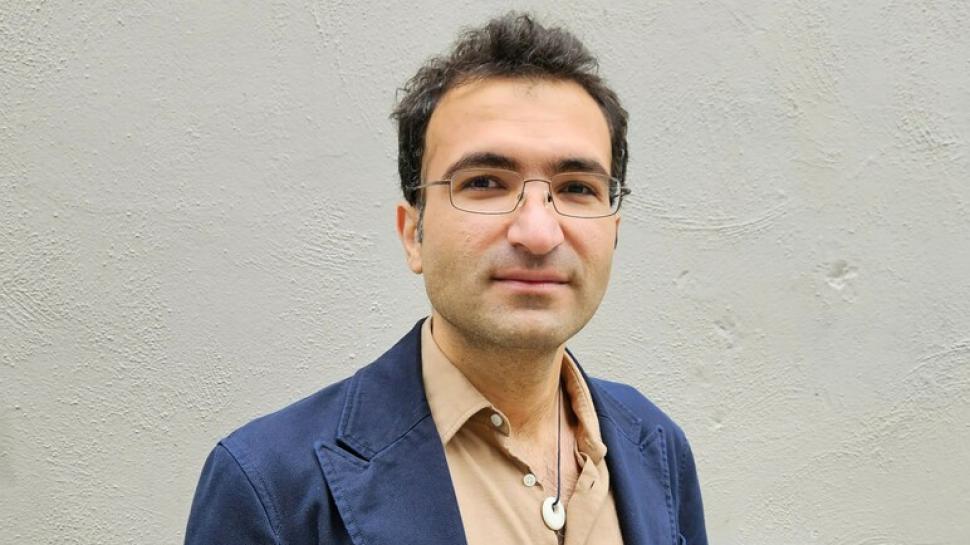 Dilan Qadir has been named as the recipient of 2023 PEN Canada-Humber College Writers in Exile Scholarship. A head and shoulders photo of a person.