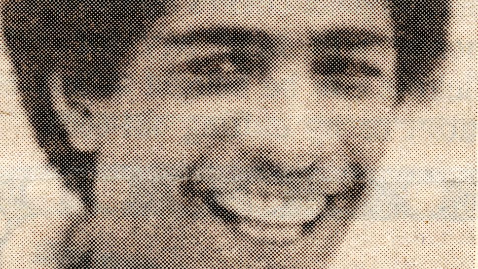 A black-and-white head-and-shoulders photo of a person.