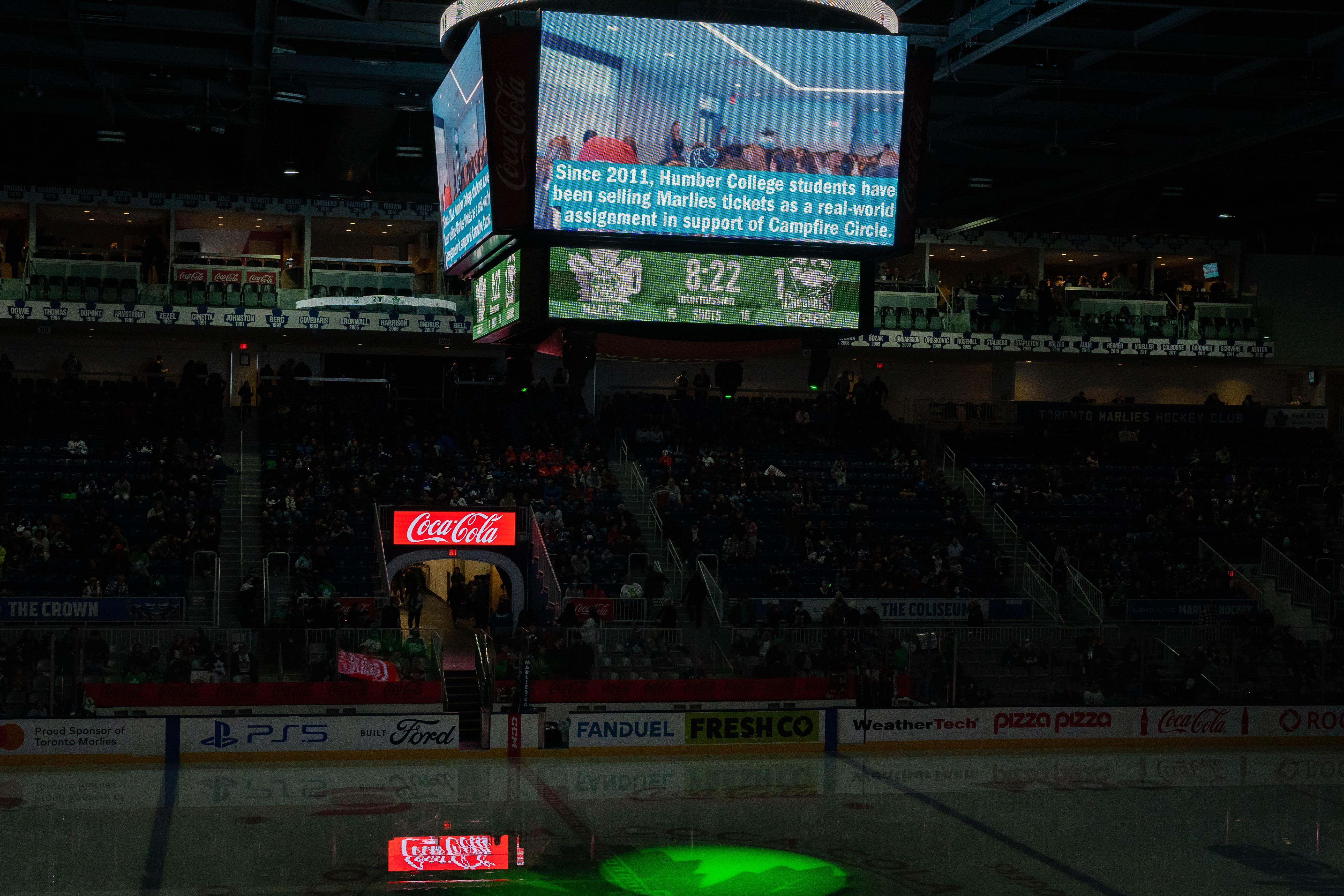 A screen reads ‘Since 2011, Humber College students have been selling Marlies tickets in support of Campfire Circle.