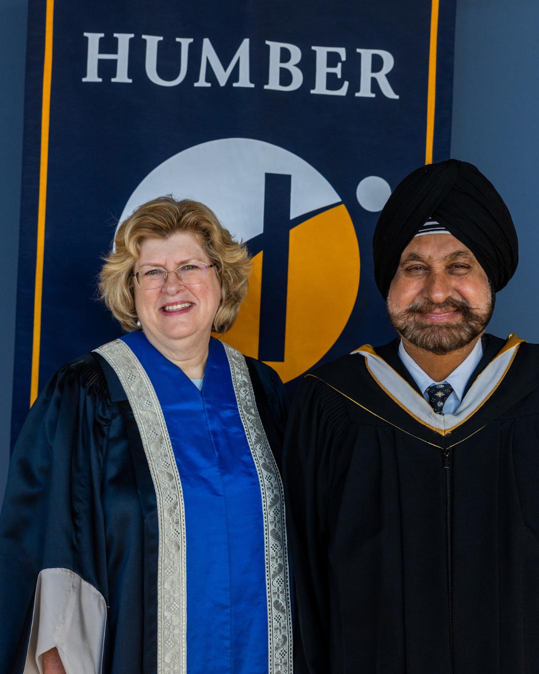 More than 3,100 graduates crossed the stage to receive their credential as part of Humber Polytechnic’s Fall 2025 Convocation ceremonies. Two smiling people stand together in front of a Humber Polytechnic banner.