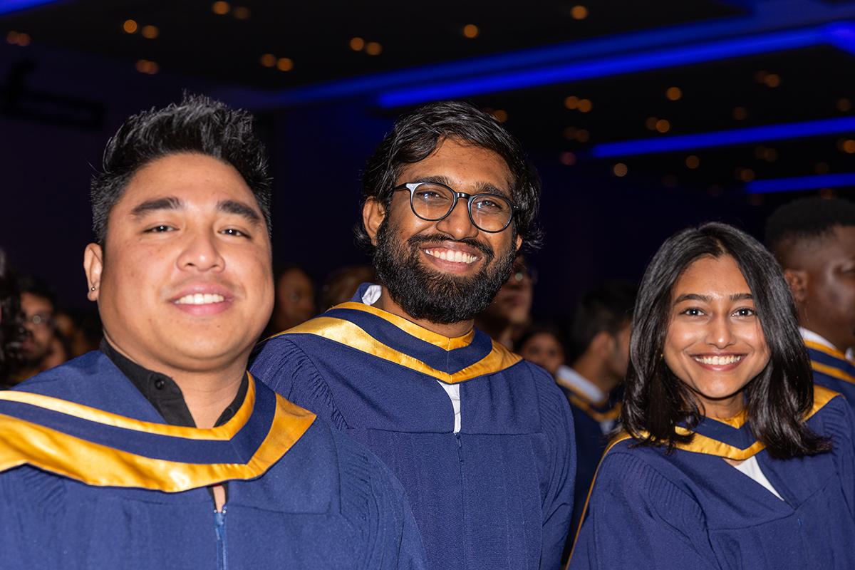 More than 3,100 graduates crossed the stage to receive their credential as part of Humber Polytechnic’s Fall 2025 Convocation ceremonies. Three smiling people stand together wearing graduation robes.