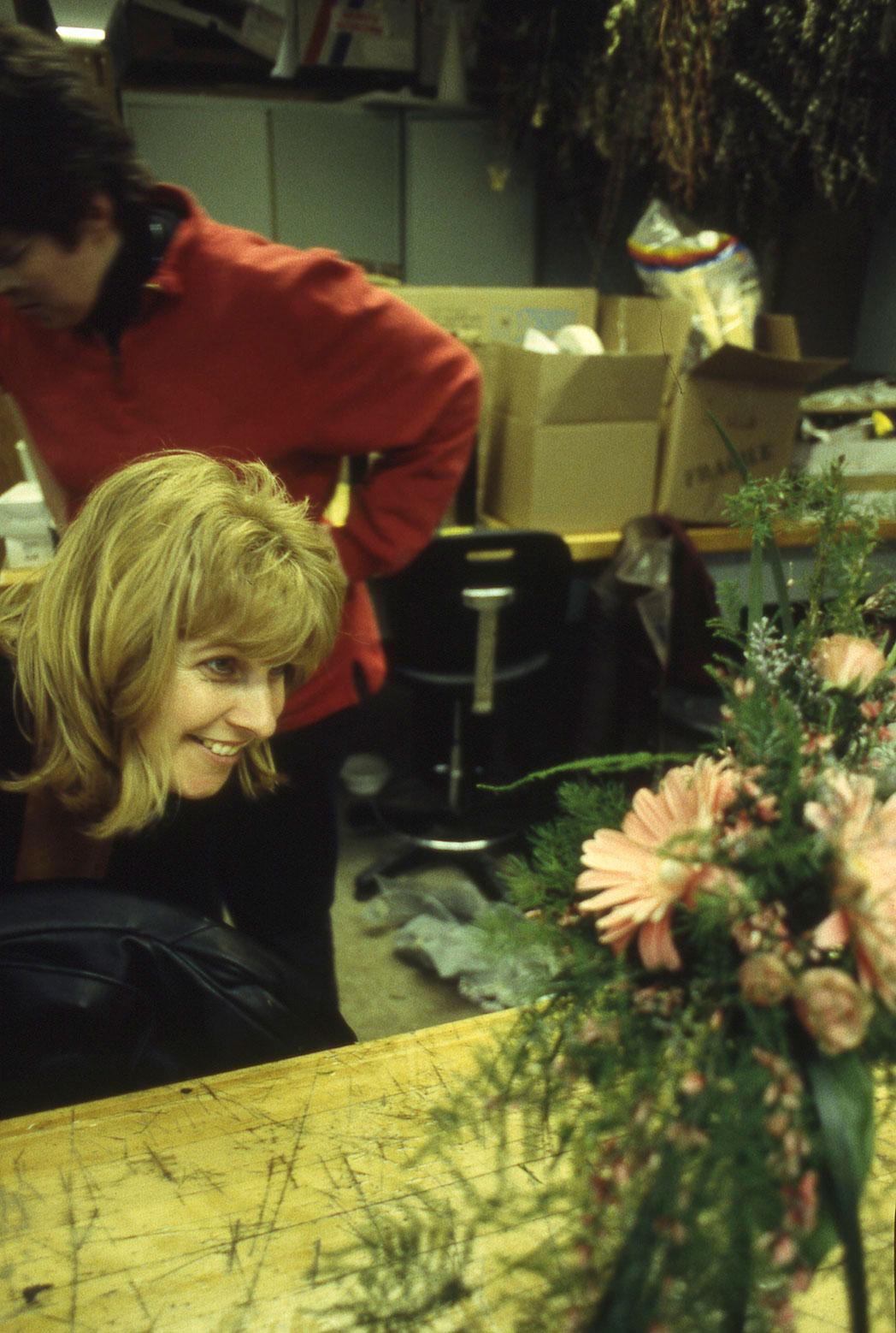 Humber Polytechnic once offered the Retail Floriculture program where students ran a fully operational flower shop at North Campus. A smiling person looks at a floral arrangement.