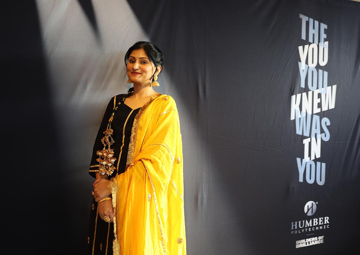 The Humber community raised more than $6,000 as part of the second annual Humber’s Got Talent event. A person stands in front of a Humber Polytechnic banner.