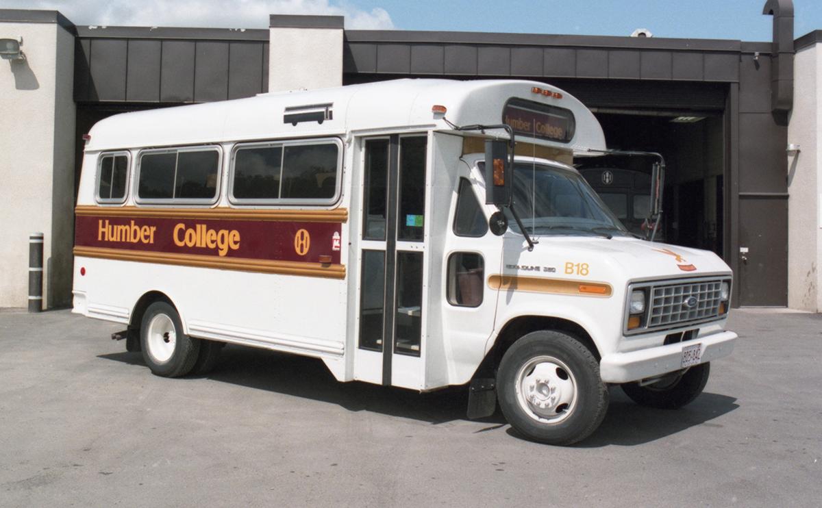 A small bus with the words Humber College on it.