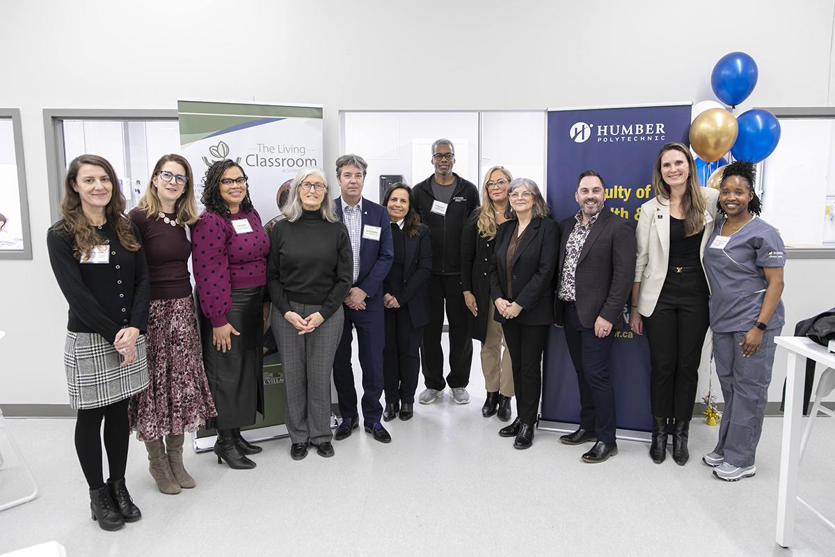 The Living Classroom at The Village of Humber Heights is a partnership between Humber’s Faculty of Health & Life Sciences and Schlegel Villages. A group of people stand together for a photo.