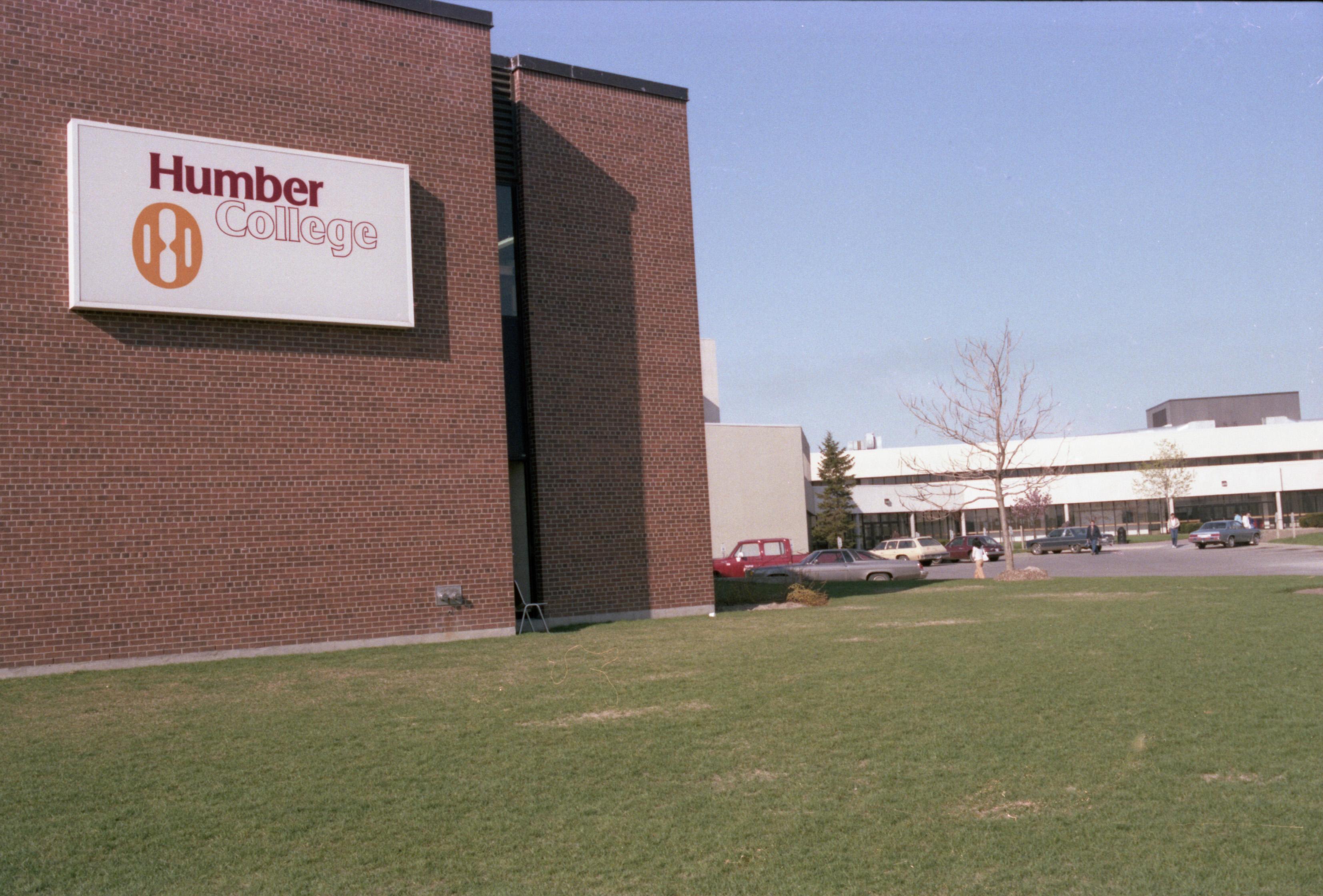 A picture of Humber College’s first logo on the side of a building.