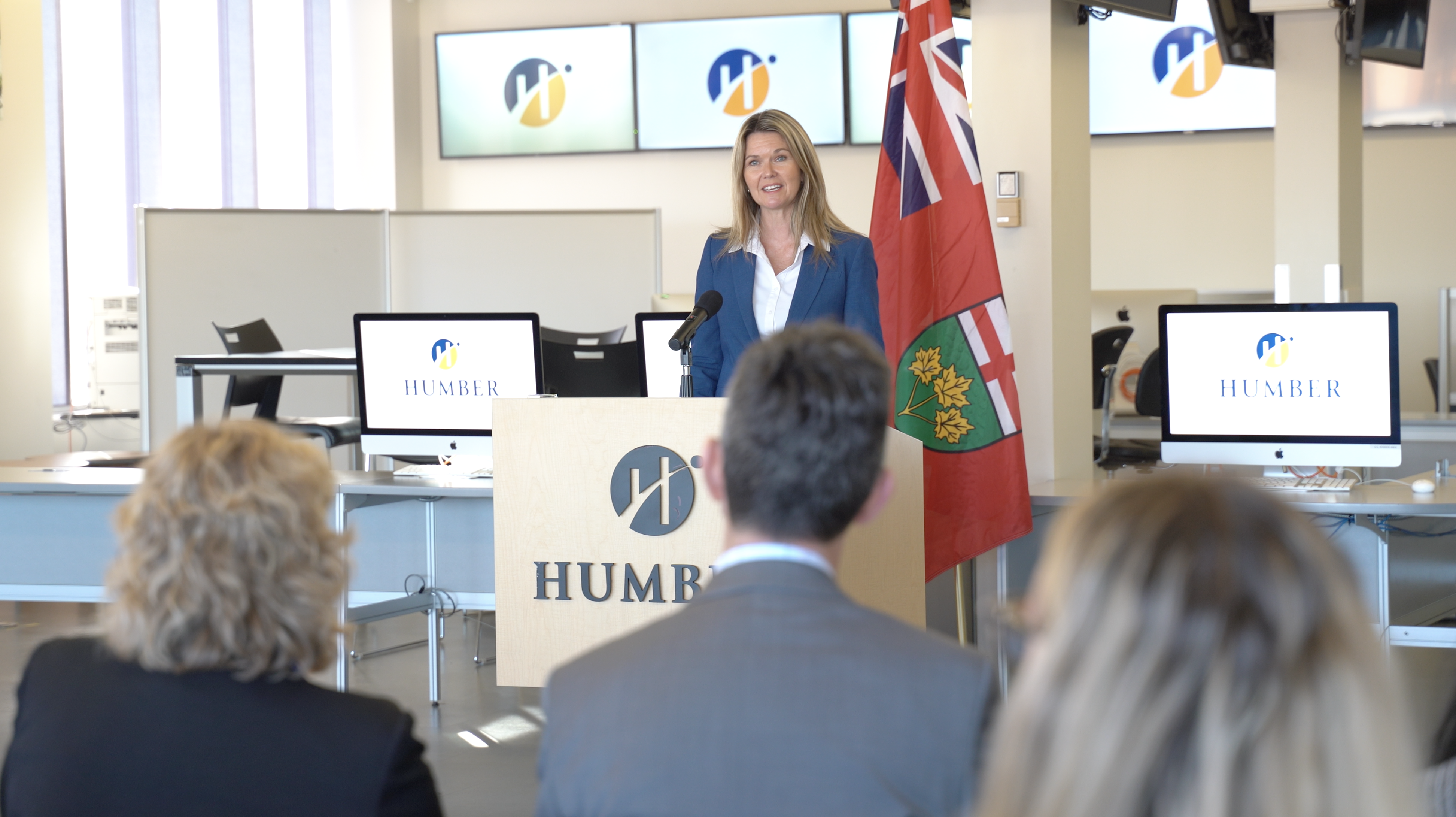 Ontario’s Minister of Colleges and Universities Jill Dunlop stands at a podium with the Humber College logo on it.