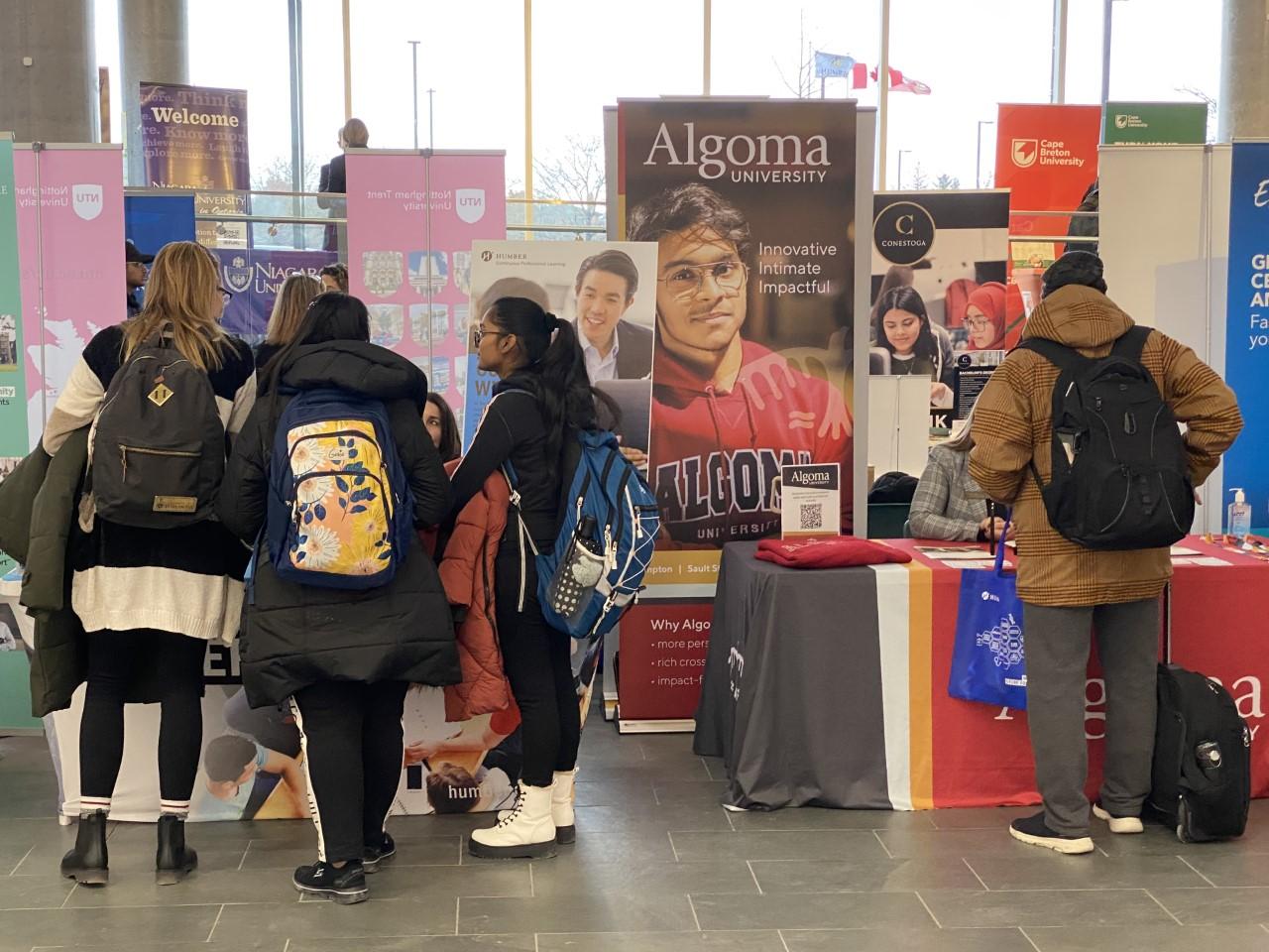 Students look at displays from Humber College and other post-secondary institutions at the Pathways Fair.