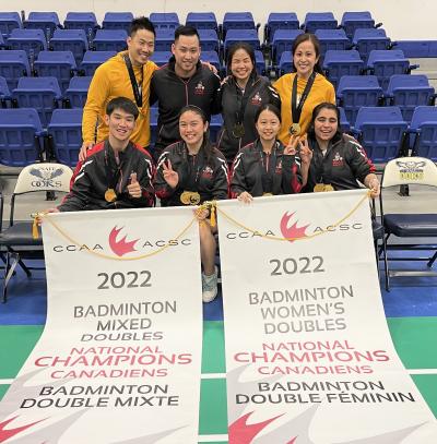 Humber Hawks' mixed doubles and women's doubles badminton teams display their national championship medals and banners