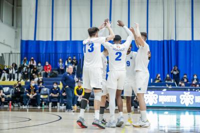 The Humber Hawks' men's volleyball team celebrates after scoring a point