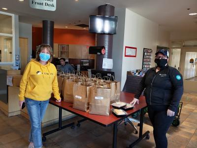 staff wore masks and gloves to handle the meals