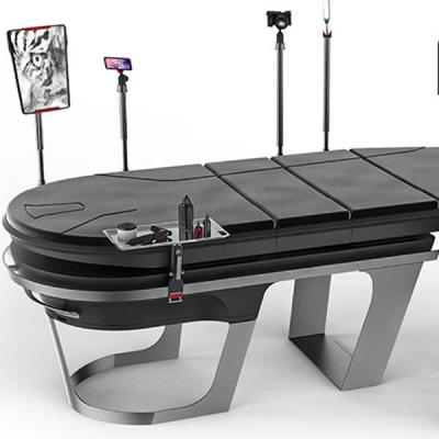 Bradley Staite's Neo Ink tattoo table looks like a customizable massage table and desk with various black and chrome attachments