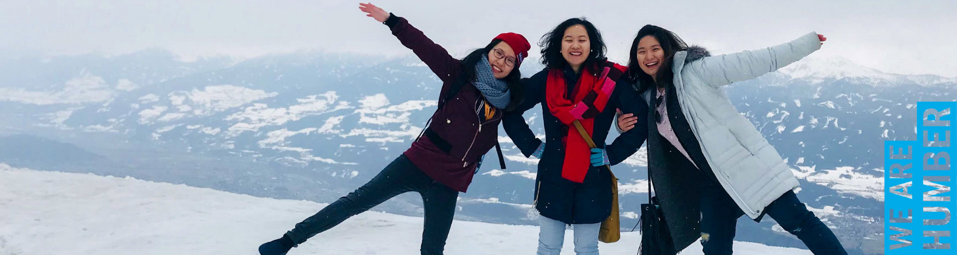 students posing on a mountain