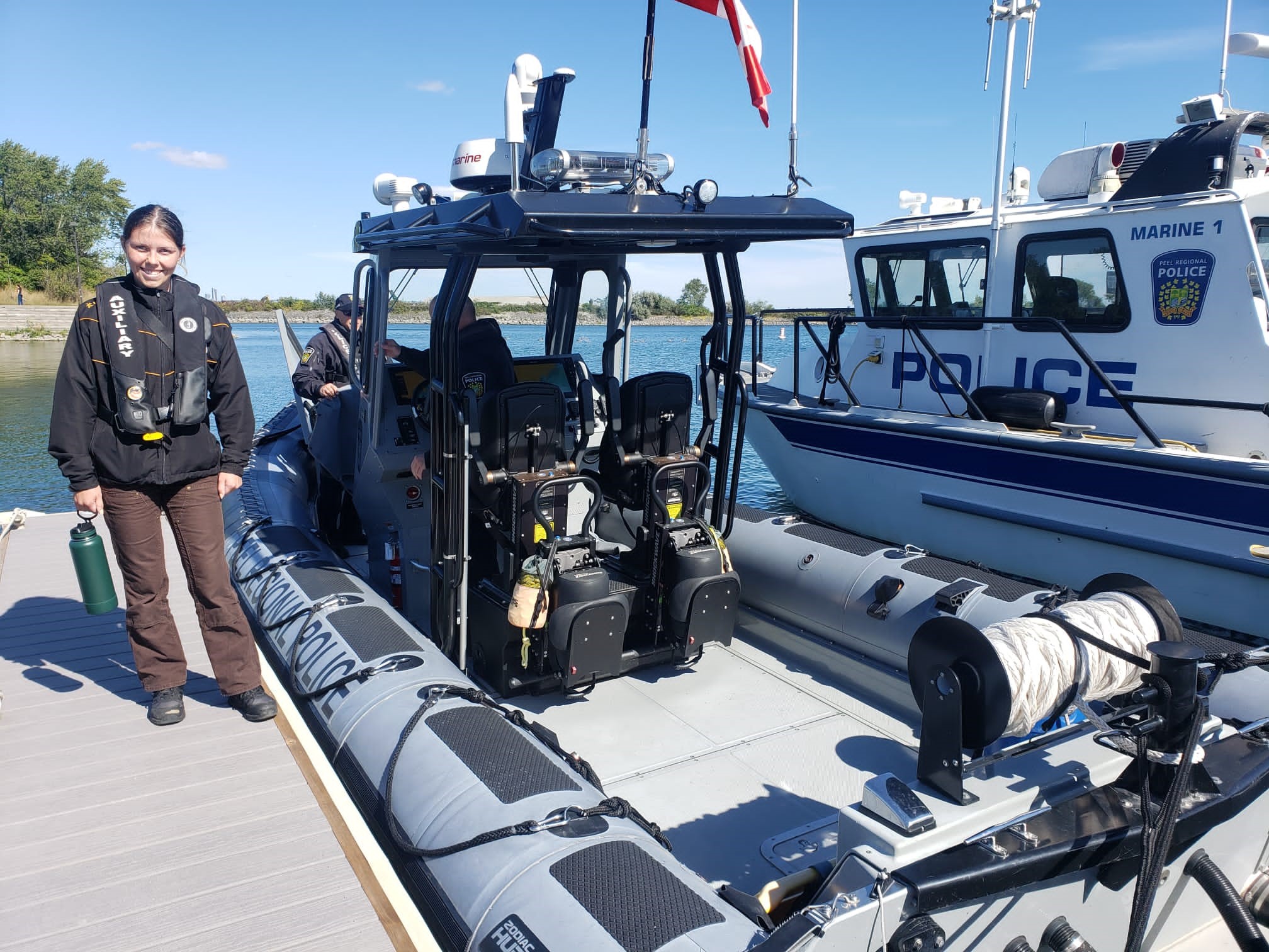 Nollner on the dock with the Peel Police Police boat 