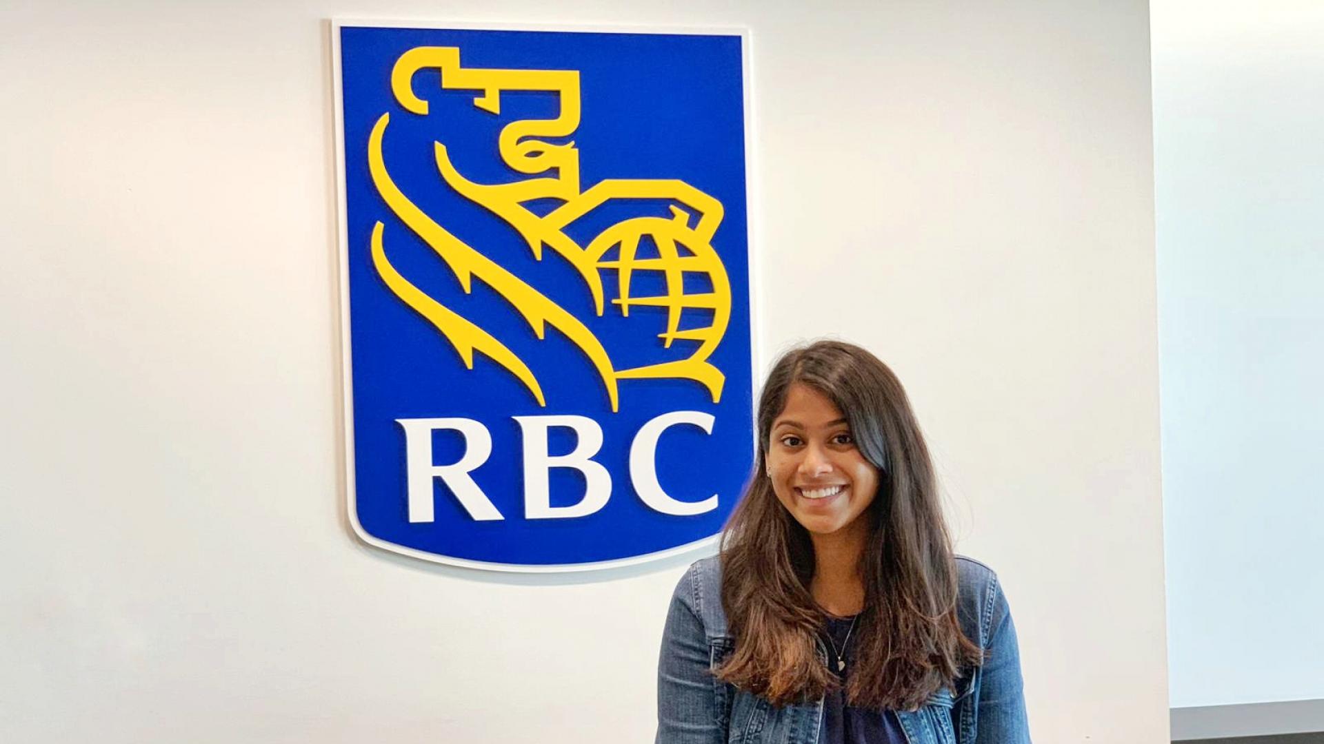 Alanis Picardo in front of the RBC logo at the head office 