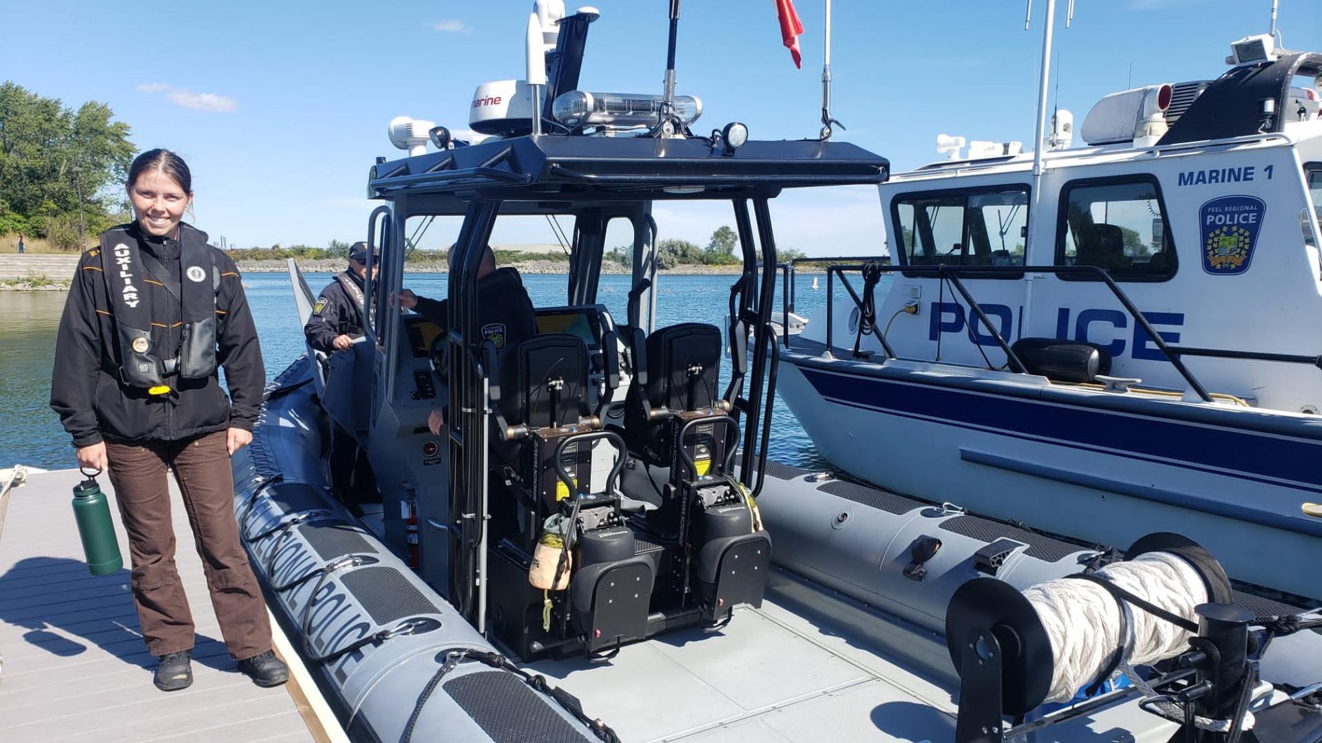 Nollner on the dock with the Peel Police Police boat 