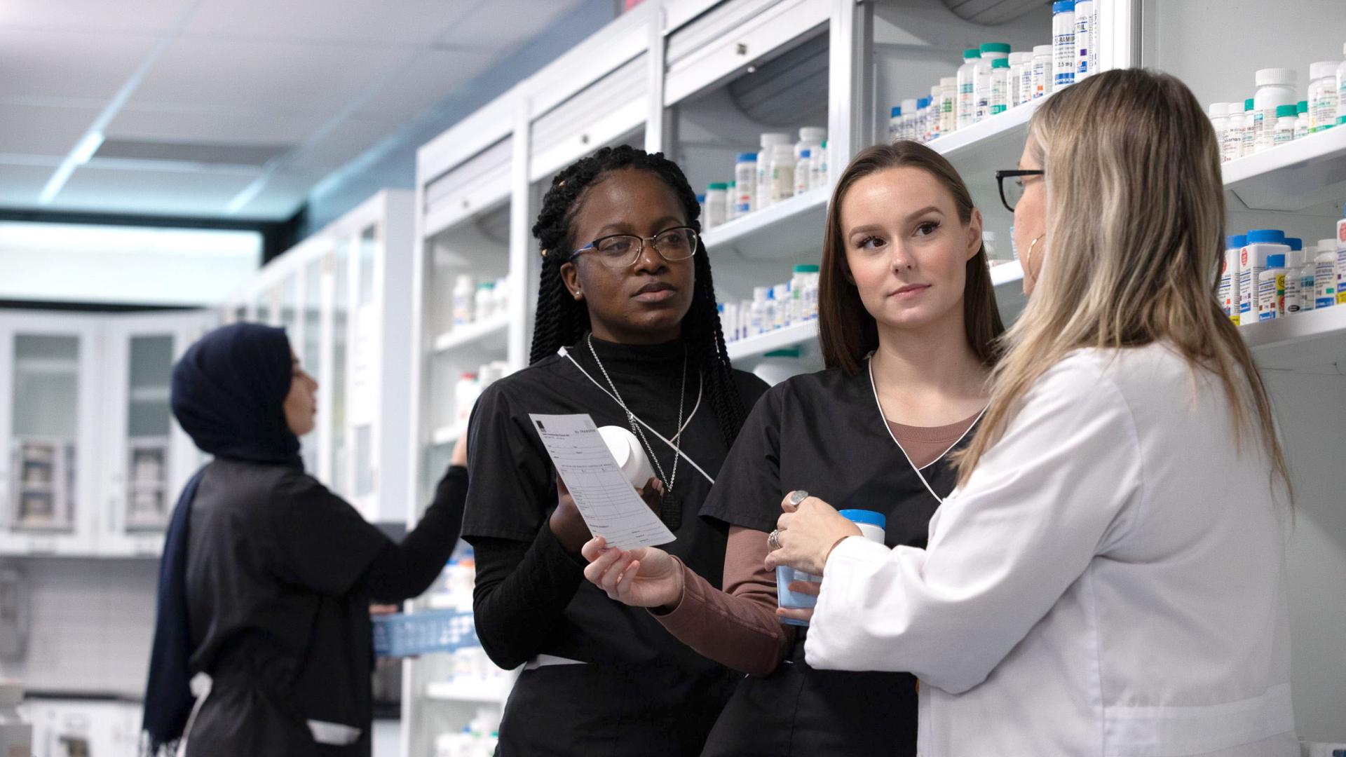 Four women working at a pharmacy